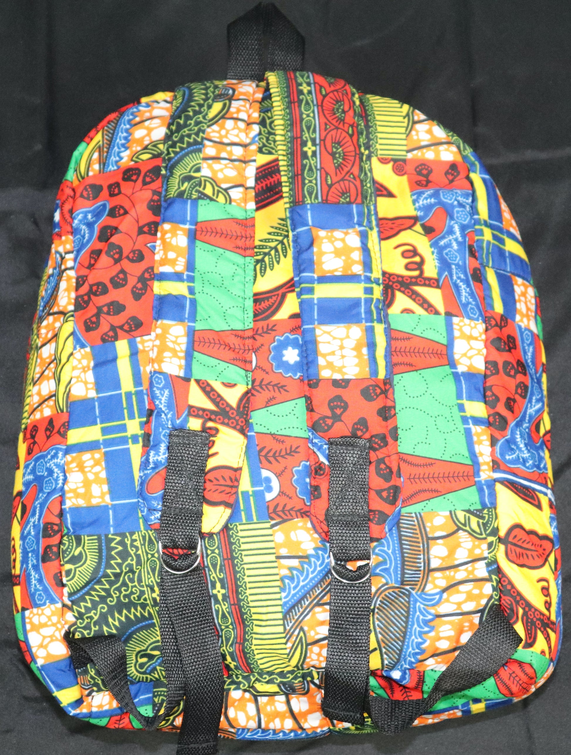 Handcrafted patchwork Ankara fabric backpack. Made in Ghana.
